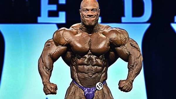 Phil Heath performing at a bodybuilding show.